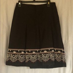 Black pleated, embroidered skirt